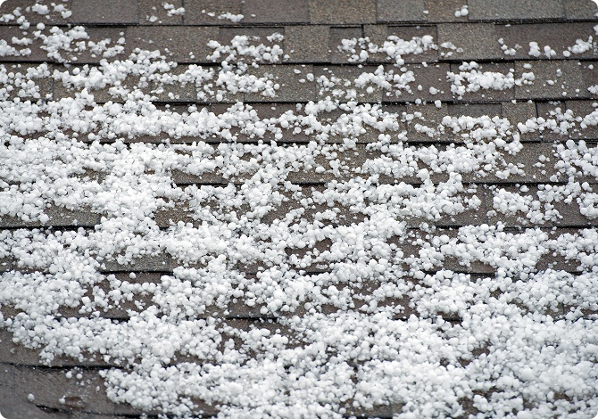 Hail accumulation on asphalt shingle roof - hail damage inspection Chicago suburbs