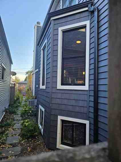 metal siding contractors on modern Chicago home exterior - metal siding contractors