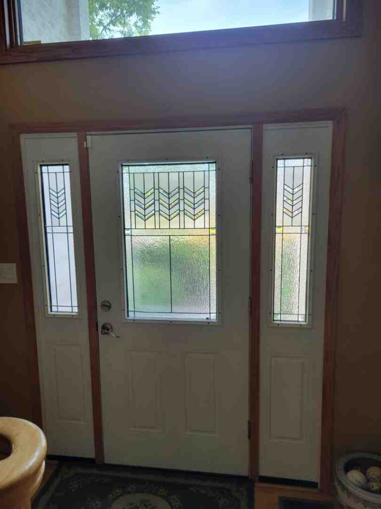 cottage style front door with sidelights