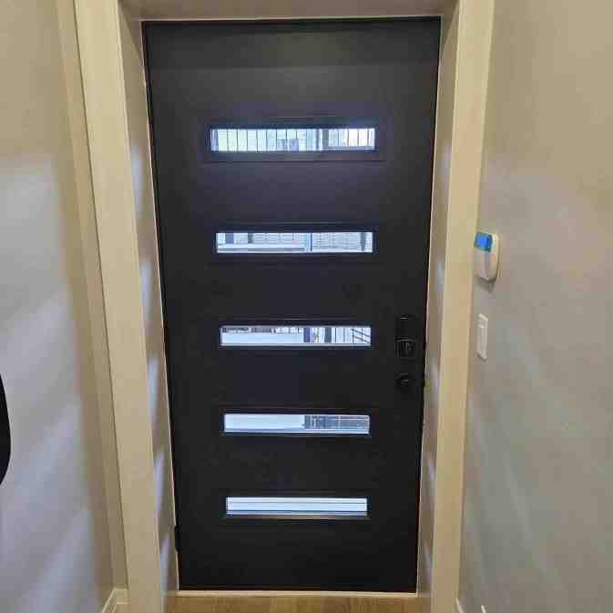 black fiberglass front door with sidelights