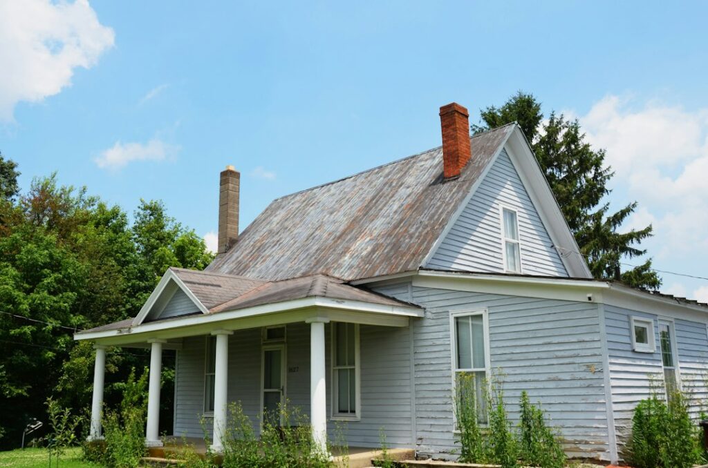 Older house undergoing exterior siding renovation